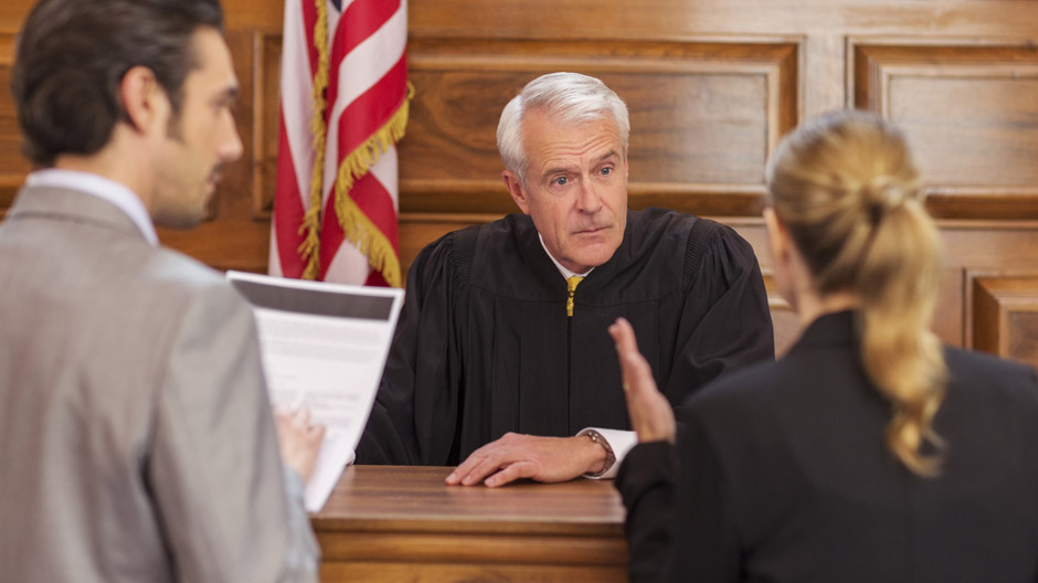 Lawyers pleading case to judge in court