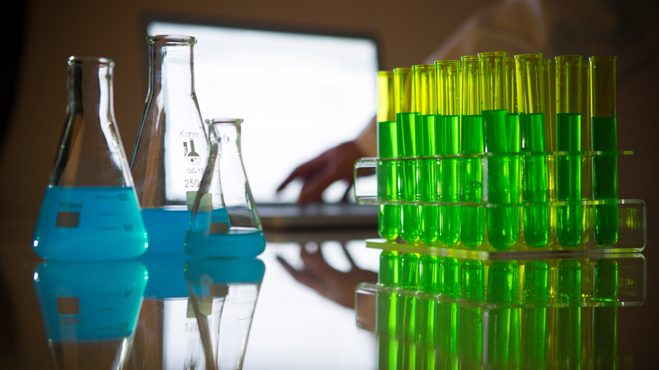 Scientist types in research lab
